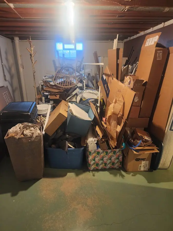 Roll-off dumpster container at job site for 2 Yard Dumpster Rental in Monroe